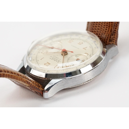 300 - Chalet chronograph mid 20th Century wrist watch having a white dial with gilt arabic numerals to the... 