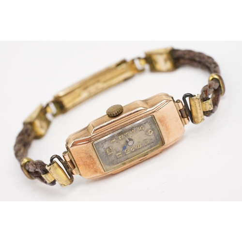 302 - 9ct gold Art Deco wrist watch having a rectangular face with arabic numerals to the chapter ring, mo... 