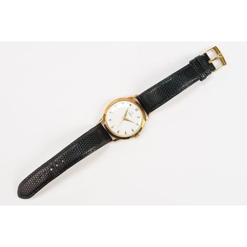 303 - Omega 14ct gold cased wrist watch having a round face with diamond shaped hour markers set to a blac... 