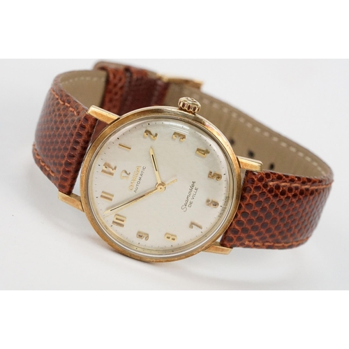 306 - Omega Seamaster De Ville automatic 9ct gold case wristwatch. The watch having a silvered dial with a... 