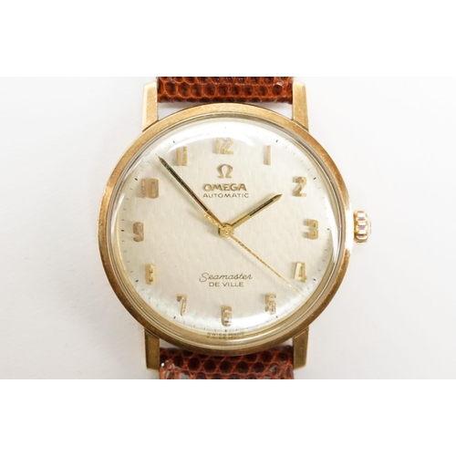 306 - Omega Seamaster De Ville automatic 9ct gold case wristwatch. The watch having a silvered dial with a... 