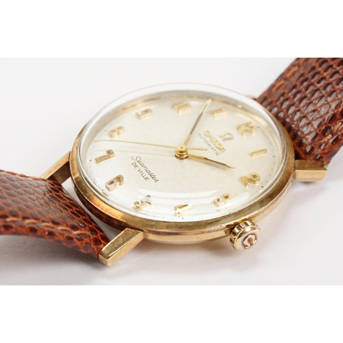 306 - Omega Seamaster De Ville automatic 9ct gold case wristwatch. The watch having a silvered dial with a... 