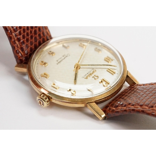 306 - Omega Seamaster De Ville automatic 9ct gold case wristwatch. The watch having a silvered dial with a... 