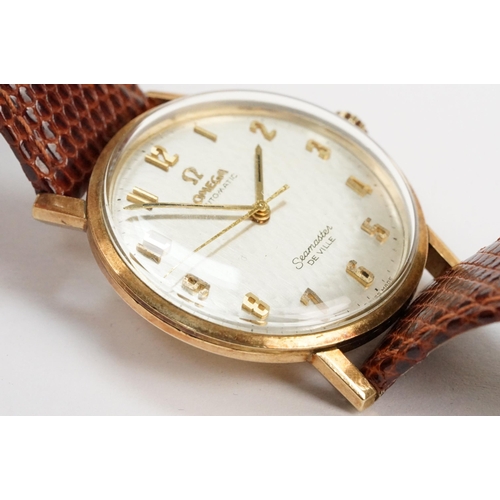 306 - Omega Seamaster De Ville automatic 9ct gold case wristwatch. The watch having a silvered dial with a... 