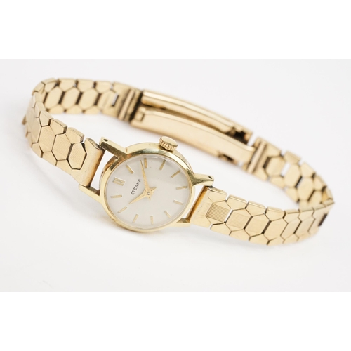 307 - 9ct gold Eterna cocktail watch having a round face with baton markers to the chapter ring on a 9ct g... 