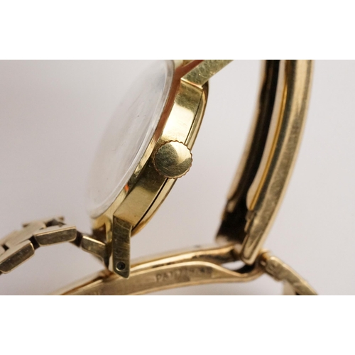 307 - 9ct gold Eterna cocktail watch having a round face with baton markers to the chapter ring on a 9ct g... 