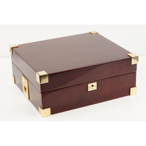 312 - Rapport of London wooden watch box with eight velvet lined compartments.