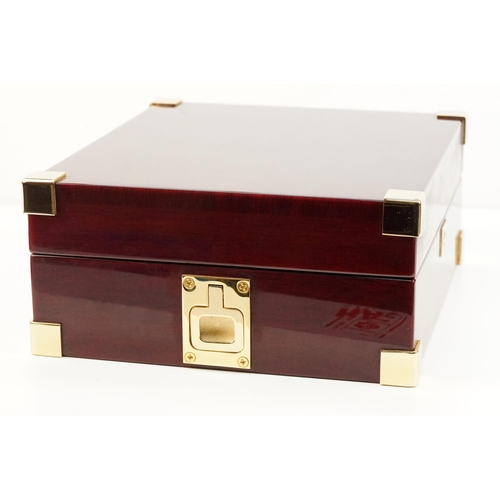 312 - Rapport of London wooden watch box with eight velvet lined compartments.