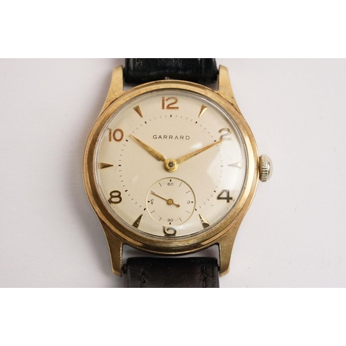 315 - Garrard 9ct gold mid Century wrist watch having a cream dial with arabic and baton markers to the ch... 