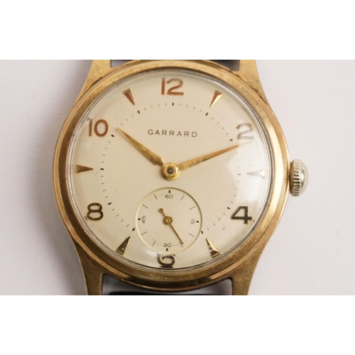 315 - Garrard 9ct gold mid Century wrist watch having a cream dial with arabic and baton markers to the ch... 