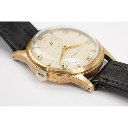 315 - Garrard 9ct gold mid Century wrist watch having a cream dial with arabic and baton markers to the ch... 