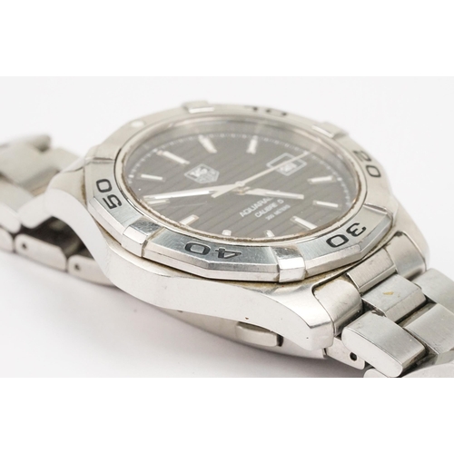 317 - Tag Heuer Aquaracer calibre 5 wrist watch. The watch having a black face with baton markings to the ... 