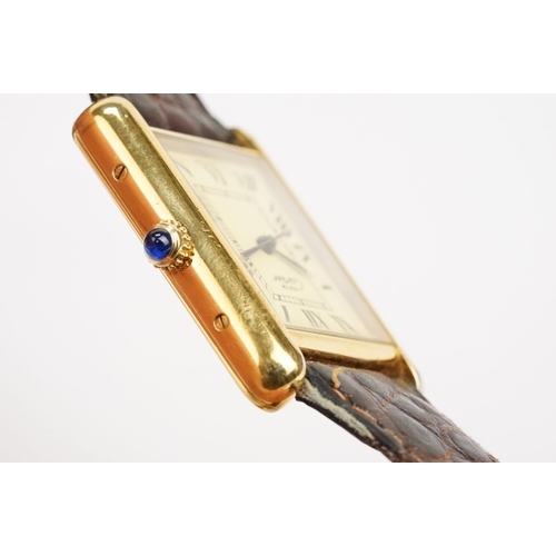 318 - Must de Cartier silver cased tank watch having a rectangular face with roman numerals to the chapter... 