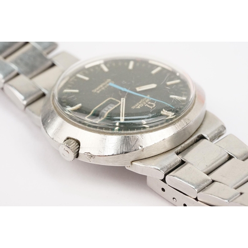 320 - Omega automatic geneve dynamic stainless steel wrist watch. The watch having a round black face with... 