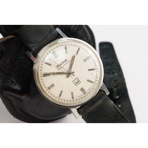 323 - Bulova Accutron 214 wristwatch having a round face with silvered dial and baton markers to chapter r... 