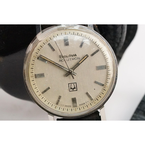 323 - Bulova Accutron 214 wristwatch having a round face with silvered dial and baton markers to chapter r... 