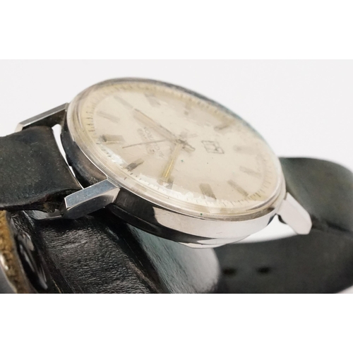 323 - Bulova Accutron 214 wristwatch having a round face with silvered dial and baton markers to chapter r... 