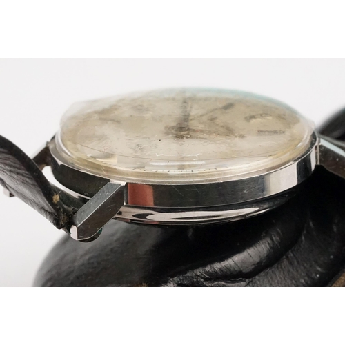 323 - Bulova Accutron 214 wristwatch having a round face with silvered dial and baton markers to chapter r... 