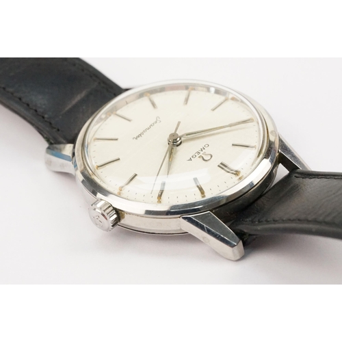 324 - 1960s Omega Seamaster wristwatch. The watch having a round face with silver baton markers to the cha... 