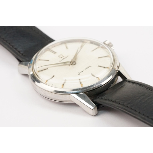 324 - 1960s Omega Seamaster wristwatch. The watch having a round face with silver baton markers to the cha... 