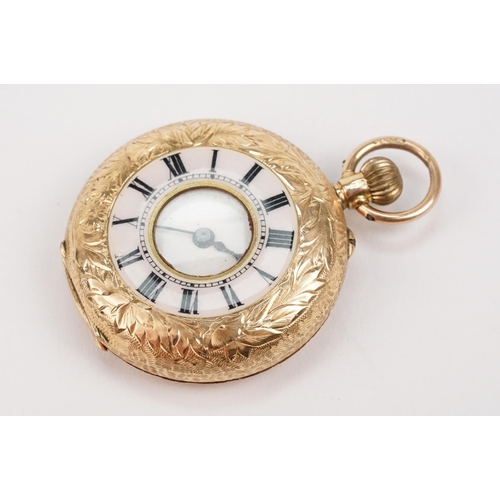 327 - Edwardian 12ct gold half hunter pocket watch having a floral engraved case with black and with ename... 