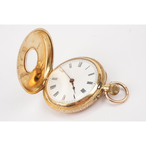 327 - Edwardian 12ct gold half hunter pocket watch having a floral engraved case with black and with ename... 