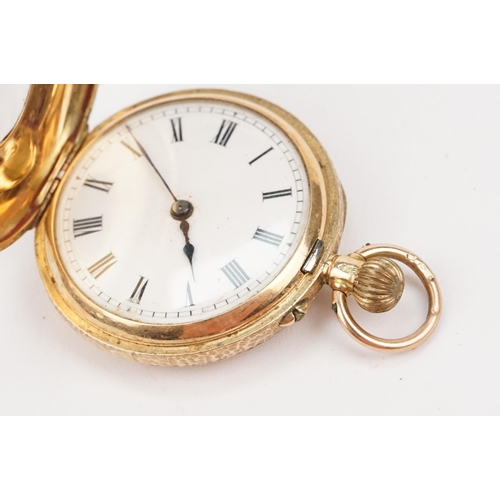 327 - Edwardian 12ct gold half hunter pocket watch having a floral engraved case with black and with ename... 