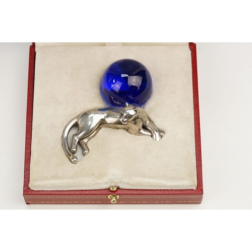 338 - Cartier silver panther paperweight in the form of a recumbent panther with blue glass orb. Signed Ca... 