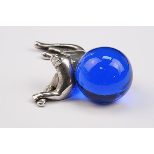 338 - Cartier silver panther paperweight in the form of a recumbent panther with blue glass orb. Signed Ca... 