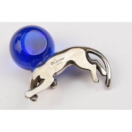 338 - Cartier silver panther paperweight in the form of a recumbent panther with blue glass orb. Signed Ca... 