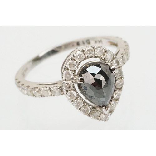 49 - 14ct white gold and black diamond ring. The ring being set with a pearl cut black diamond to centre ... 