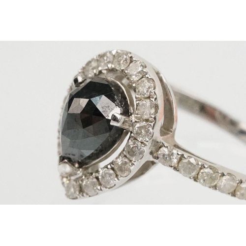 49 - 14ct white gold and black diamond ring. The ring being set with a pearl cut black diamond to centre ... 