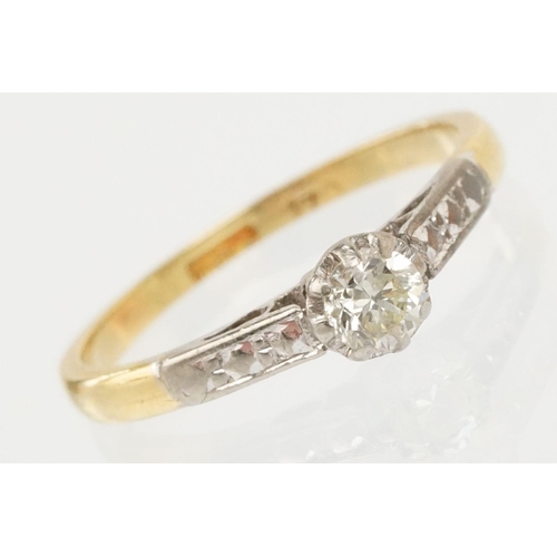 53 - 18ct gold diamond ring. The ring being set with a round brilliant cut diamond with platinum engraved... 