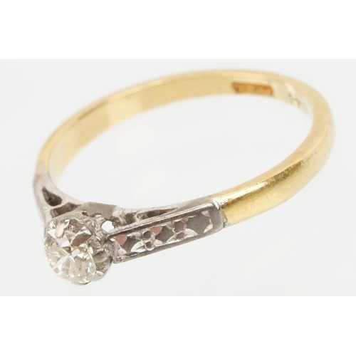 53 - 18ct gold diamond ring. The ring being set with a round brilliant cut diamond with platinum engraved... 