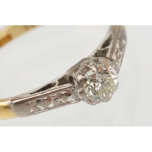 53 - 18ct gold diamond ring. The ring being set with a round brilliant cut diamond with platinum engraved... 