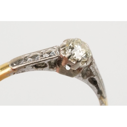 53 - 18ct gold diamond ring. The ring being set with a round brilliant cut diamond with platinum engraved... 