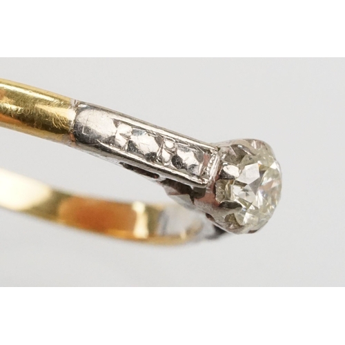 53 - 18ct gold diamond ring. The ring being set with a round brilliant cut diamond with platinum engraved... 