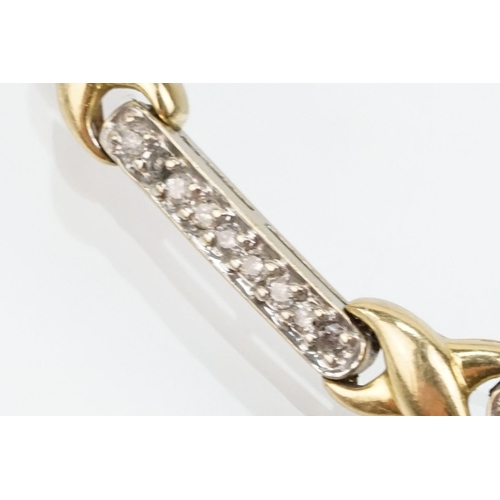 60 - 14ct gold two tone kiss link bracelet having diamond set bar links with a box clasp. Marked 14k to s... 