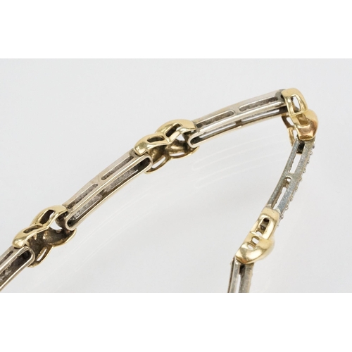 60 - 14ct gold two tone kiss link bracelet having diamond set bar links with a box clasp. Marked 14k to s... 