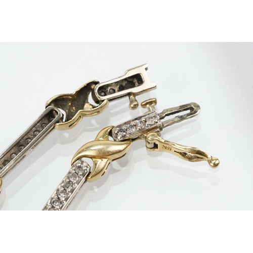 60 - 14ct gold two tone kiss link bracelet having diamond set bar links with a box clasp. Marked 14k to s... 