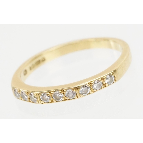 61 - 18ct gold and diamond half eternity ring. Hallmarked London 1985. Size J.5.