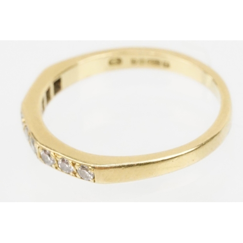 61 - 18ct gold and diamond half eternity ring. Hallmarked London 1985. Size J.5.