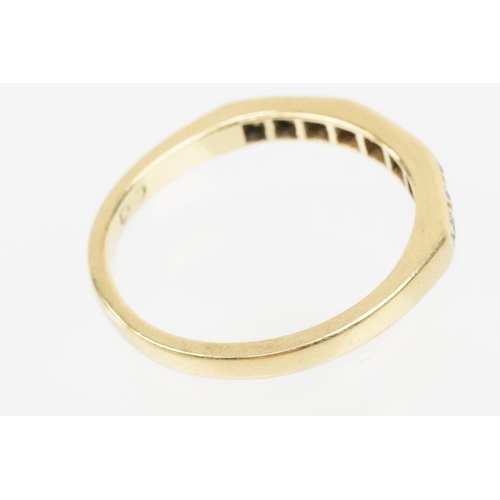 61 - 18ct gold and diamond half eternity ring. Hallmarked London 1985. Size J.5.