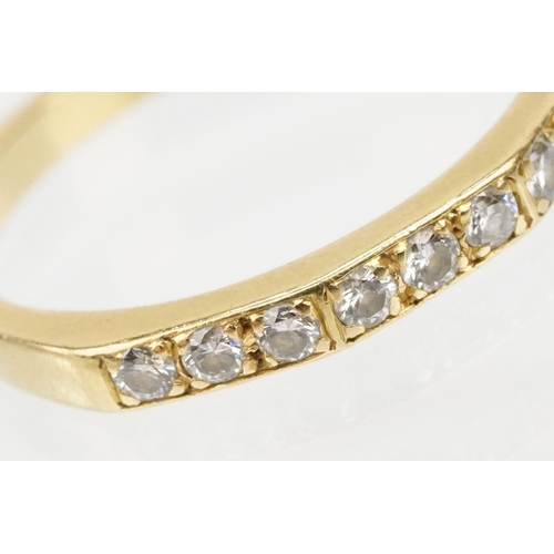 61 - 18ct gold and diamond half eternity ring. Hallmarked London 1985. Size J.5.