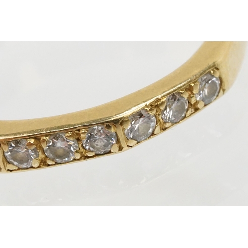 61 - 18ct gold and diamond half eternity ring. Hallmarked London 1985. Size J.5.