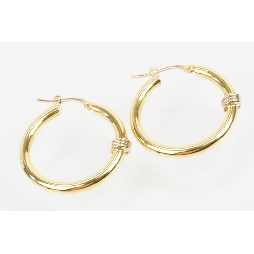 68 - Pair of 18ct gold hoop earrings having hinge posts with coiled detail to front. Italian hallmarked t... 