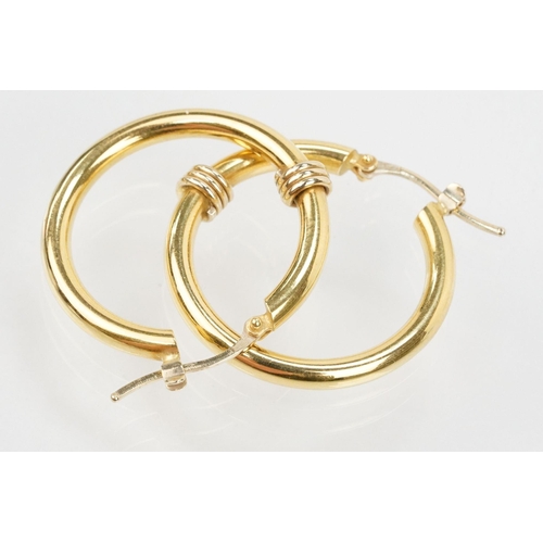 68 - Pair of 18ct gold hoop earrings having hinge posts with coiled detail to front. Italian hallmarked t... 