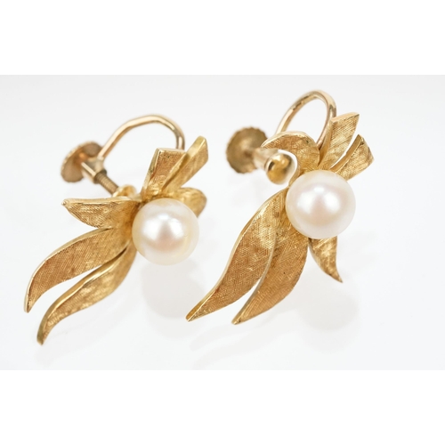 11 - Pair of Mikimoto 18ct gold and cultured pearl screw back earrings. The earrings having gold floral s... 