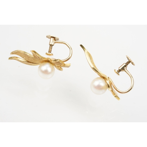 11 - Pair of Mikimoto 18ct gold and cultured pearl screw back earrings. The earrings having gold floral s... 