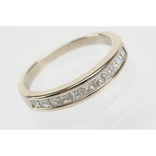 13 - 14ct white gold and diamond half eternity ring channel set with eleven princess cut diamonds. Marked... 